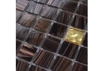 Mozaik tamnih pločica sa jednom zlatnom pločicom